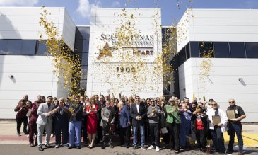 STHS employees celebrating 30th anniversary in front of the hospital