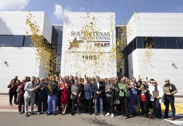 STHS employees celebrating 30th anniversary in front of the hospital