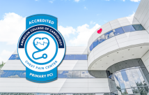 The chest pain badge superimposed over an image of the hospital