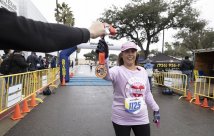 5k participant being handed their medal