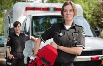 EMS professional in front of ambulance